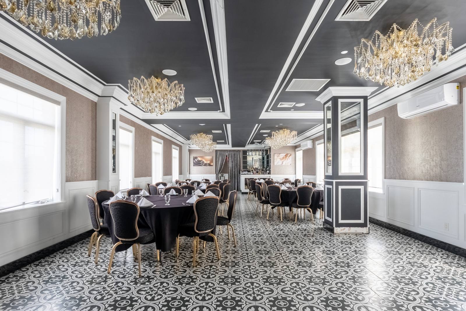 The Chandelier Room looking toward the private bar and draped entry